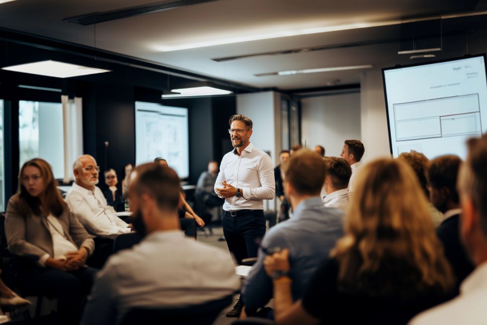 public speaking is essential for corporate success, speaker in circle presenting