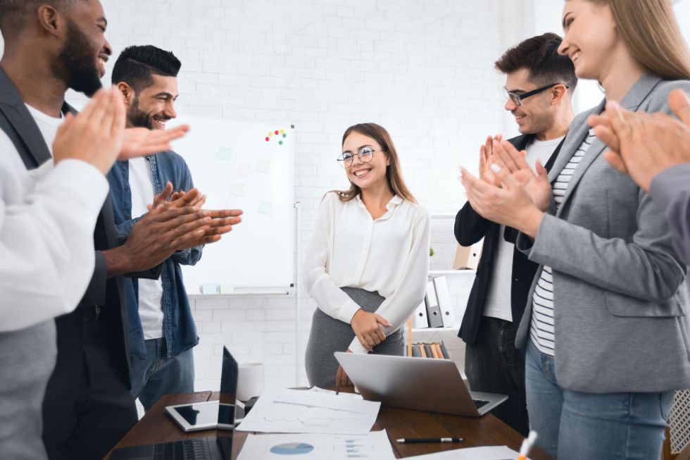 employee-induction-public-speaking-training-1 team welcoming a new employee ready for induction public speaking training